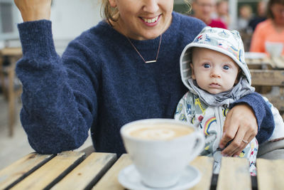 Mother with baby in cafe