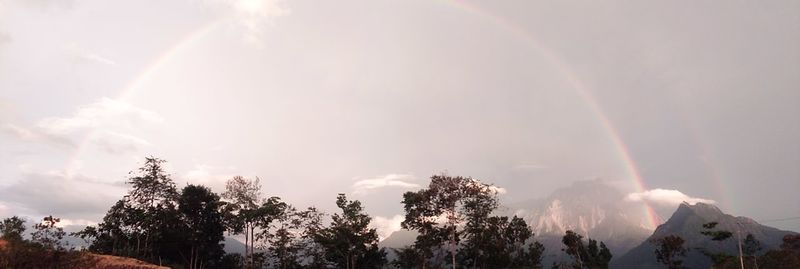 Low angle view of rainbow in sky