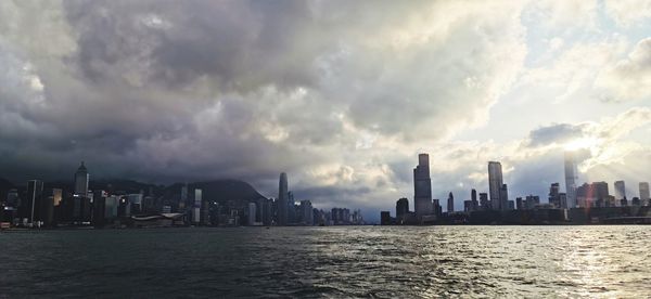 Panoramic view of sea and buildings against sky