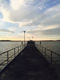 Pier over sea against sky