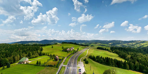 Panoramic shot of green landscape against sky