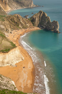 High angle view of rocks on sea shore