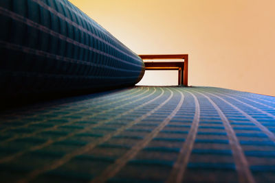 Close-up of piano against blue sky