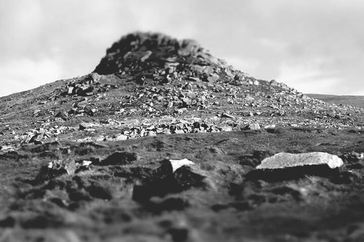 mountain, sky, rock - object, rock formation, landscape, tranquility, tranquil scene, rocky mountains, nature, physical geography, scenics, geology, low angle view, cloud - sky, non-urban scene, mountain range, day, beauty in nature, cloud, travel destinations