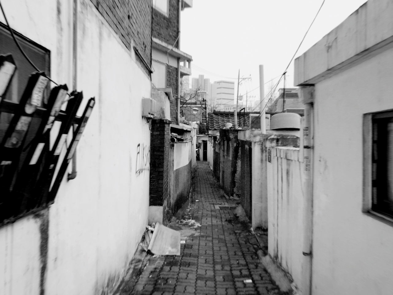 FOOTPATH AMIDST BUILDINGS IN TOWN