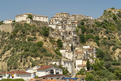 Buildings in town against sky