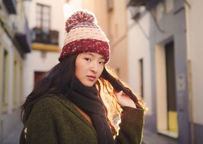 Portrait of smiling young woman in snow