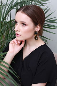 Portrait of young woman with arms crossed
