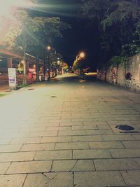 Street lights in illuminated city at night