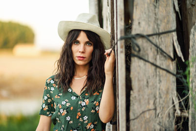 Portrait of beautiful young woman in hat