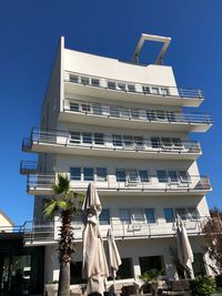 Low angle view of building against clear blue sky