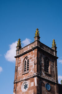 Low angle view of church against clear blue sky