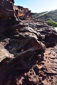 Close-up of rock formation on land against clear sky