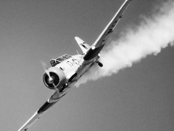 Low angle view of airplane against sky