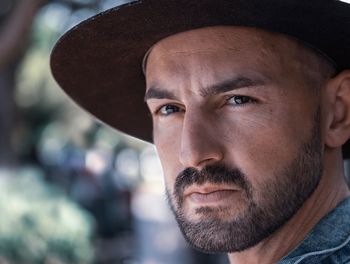 Close-up portrait of man wearing hat