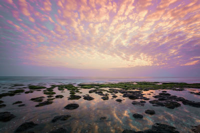 Scenic view of sea against sky at sunset