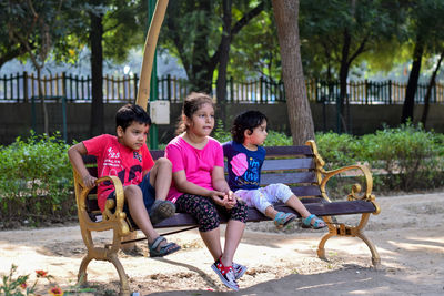 Women sitting on bench in park