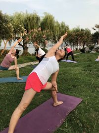 Women exercising at park