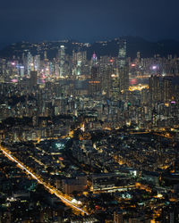 High angle view of illuminated city buildings at night