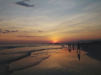 Scenic view of beach against sky during sunset
