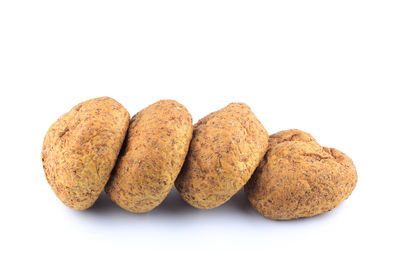 Close-up of bread against white background