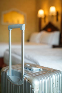 Close-up of luggage in bedroom
