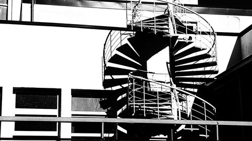 Low angle view of spiral staircase against building
