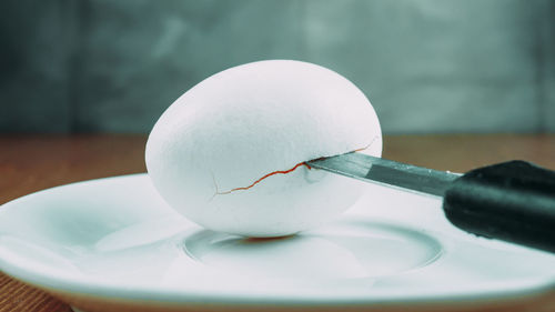 Close-up of eggs in plate on table