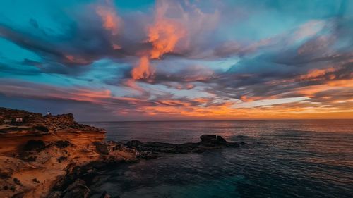 Scenic view of sea against sky during sunset