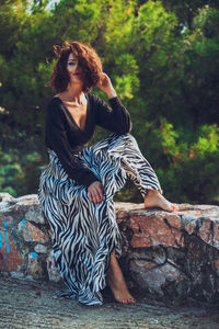 Portrait of woman sitting outdoors