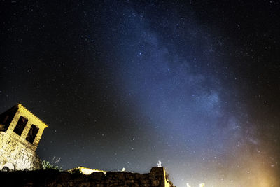 Low angle view of building against sky at night