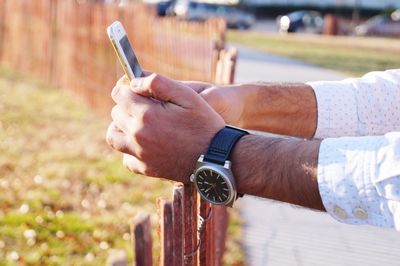 Close-up of man holding phone 