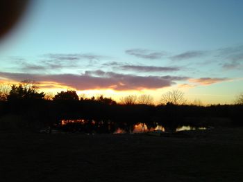 Scenic view of landscape at sunset