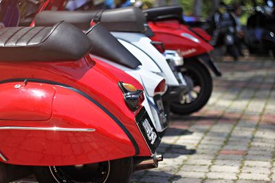 Colorful motorcycles parked on street