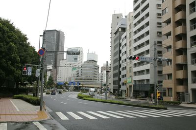 Road in city against clear sky