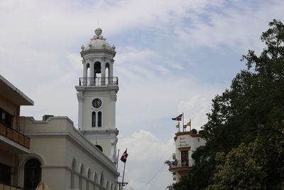 Low angle view of bell tower against sky