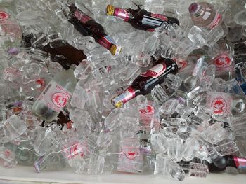 High angle view of bottles on glass