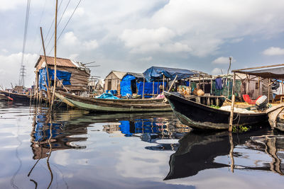 Boats moored at harbor