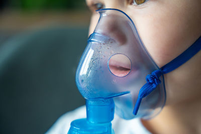 Close-up of woman wearing protective mask