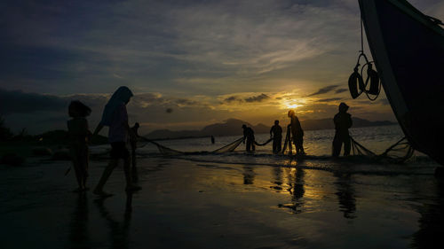 Nellifter is cleaning the net on javanese coast, banda aceh. saturday, january 11, 2020