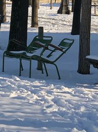 Chairs on beach during winter