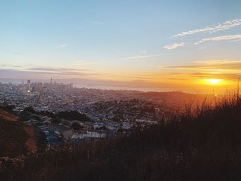 High angle view of buildings against sky during sunset