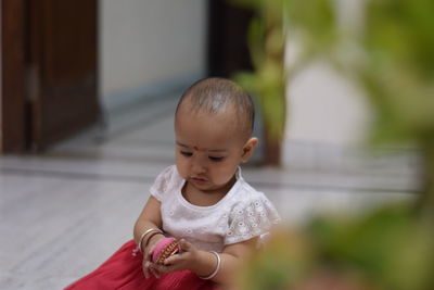 Close-up of cute baby girl outdoors