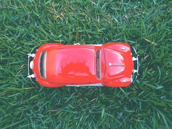 High angle view of red car on field