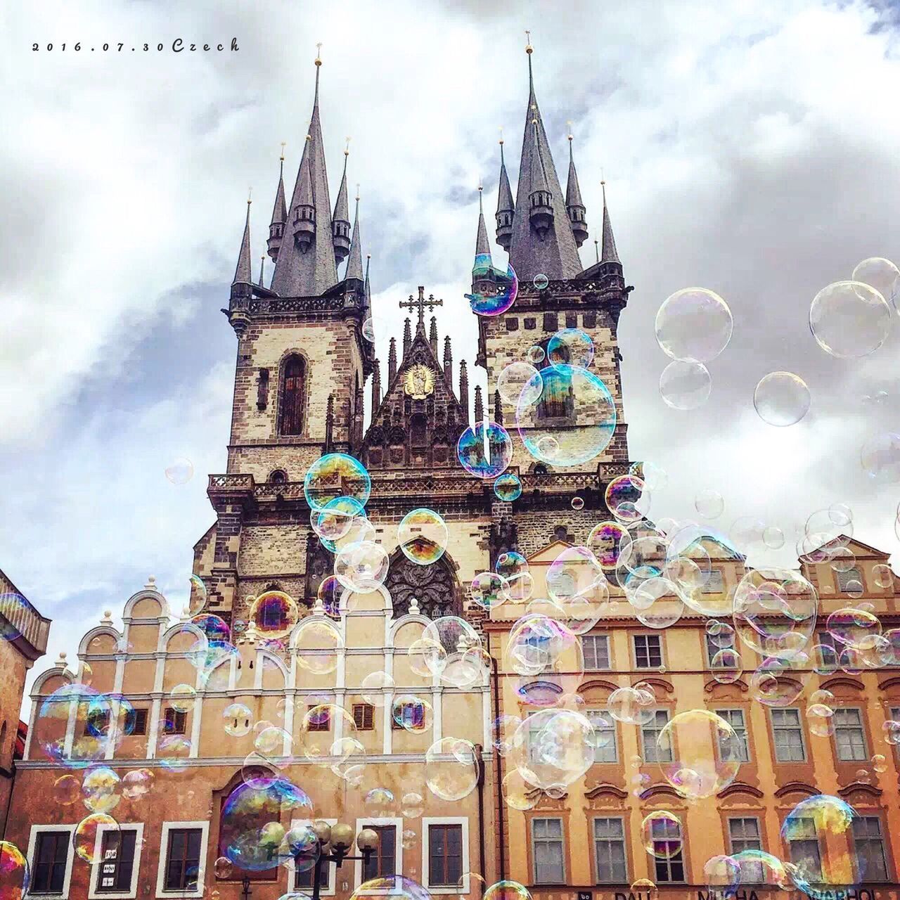 architecture, built structure, low angle view, sky, cloud - sky, clock tower, city, travel destinations, cloud, cloudy, outdoors, day, facade, tourism, tall - high, capital cities, city life, blue, no people