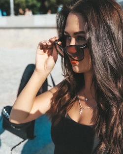 Portrait of young woman wearing sunglasses