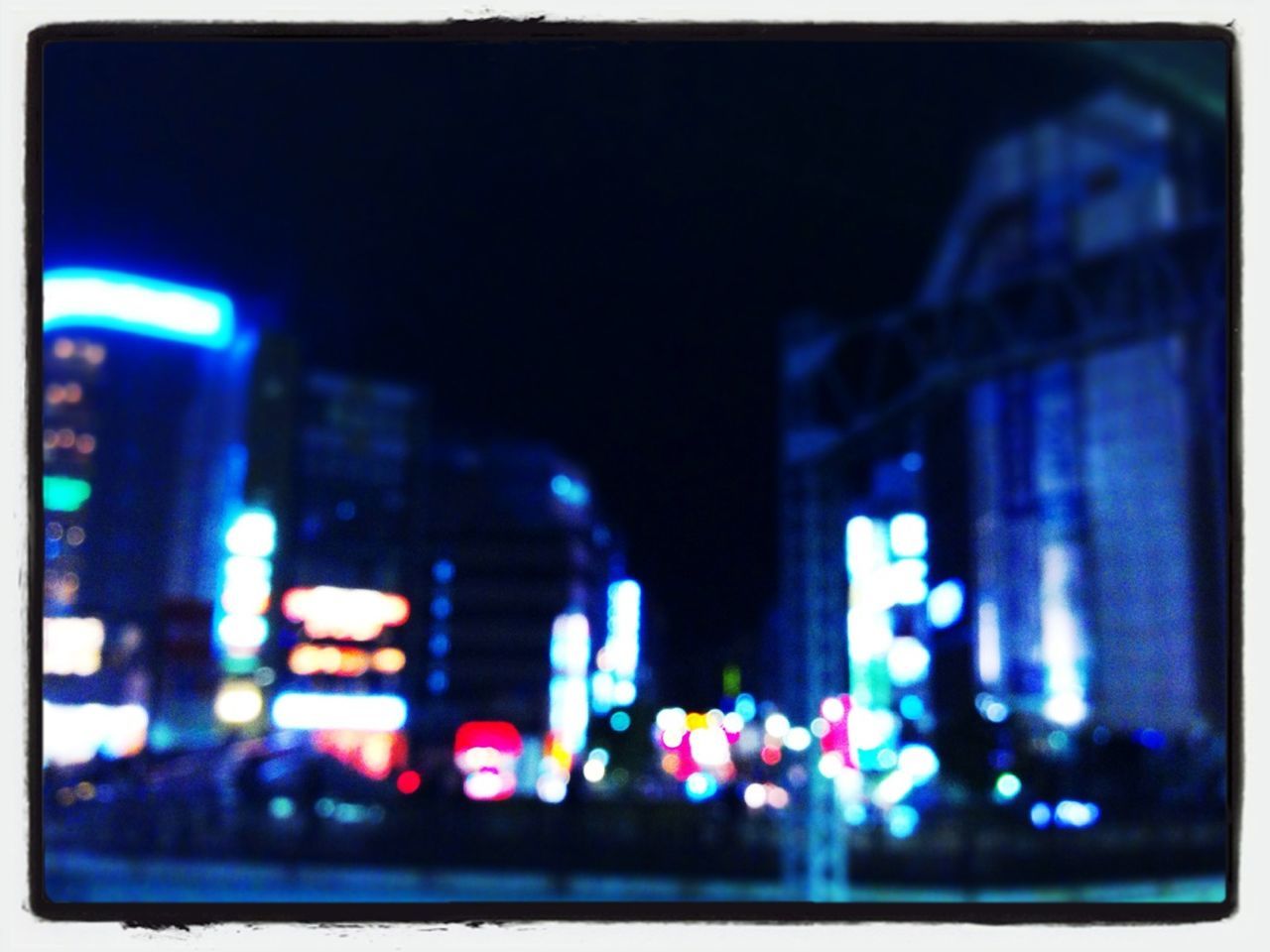 illuminated, night, transfer print, building exterior, architecture, city, built structure, auto post production filter, lighting equipment, light - natural phenomenon, defocused, dark, city life, blue, blurred motion, transportation, light, glowing, selective focus, building