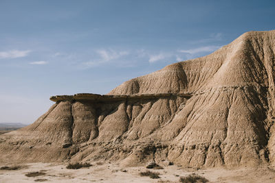 Rock formations on mountain against sky