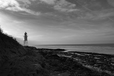 Scenic view of sea against sky with blacknore point lighthouse
