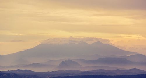 Scenic view of mountains against sky during sunset